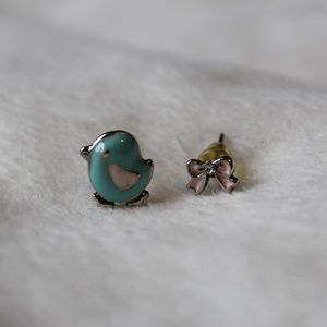 Mismatching Bird and Bow stud earrings